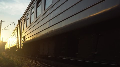 passenger train fast running to the sunset
