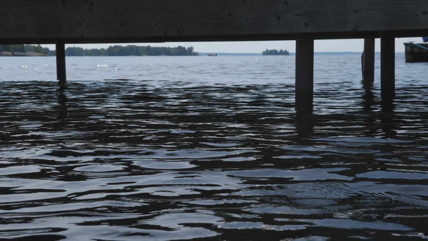 Lake surface with dock in summer. Lake Nipissing, Ontario, Canada.
