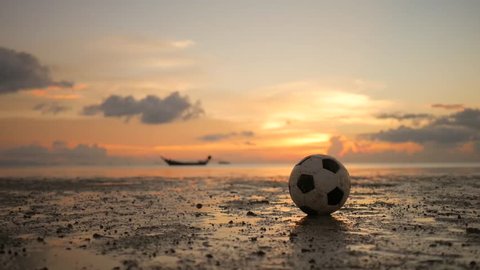 Soccer Football on the Sandy Beach Againsts Golden Sunset and Sea. HD, 1920x1080 Slowmotion. Koh Phangan, Thailand.