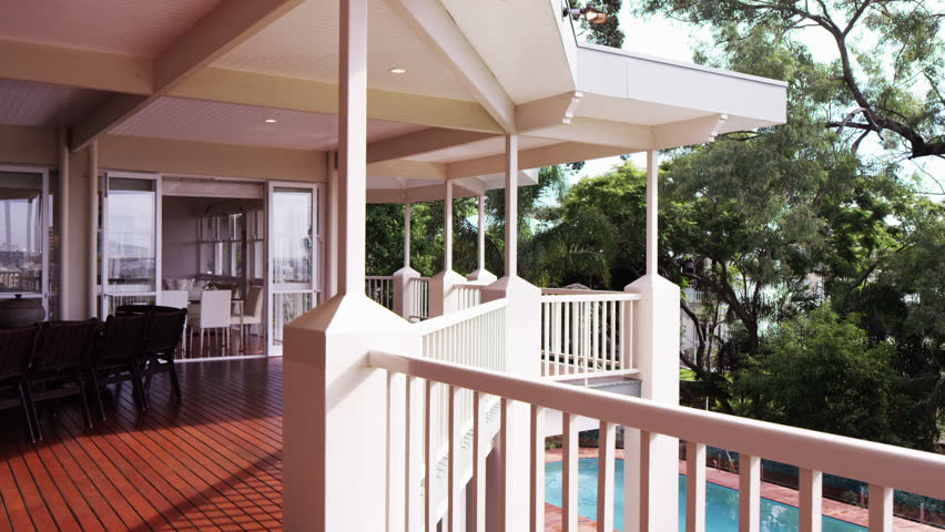 outdoor deck overlooking pool and trees