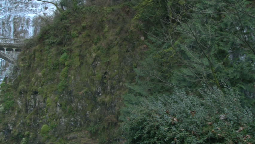 Multnomah Falls with bridge scenic in Oregon during winter, panning shot.