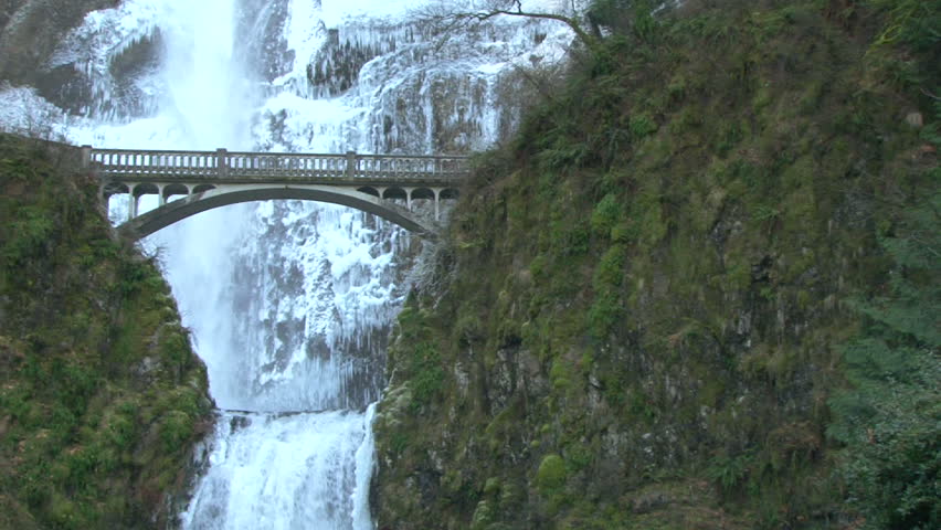 Multnomah Falls with bridge scenic in Oregon during winter, panning shot.