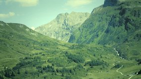 Alpine massif, beautiful Alpine canyon in Austria. Alpine Gastein Valley in summer. Mountains and pastures. Fresh air and healthy virgin nature. Excursional destination for hiking, vacation.