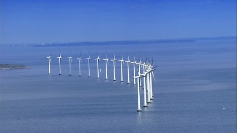 Aerial view of wind turbines at sea
