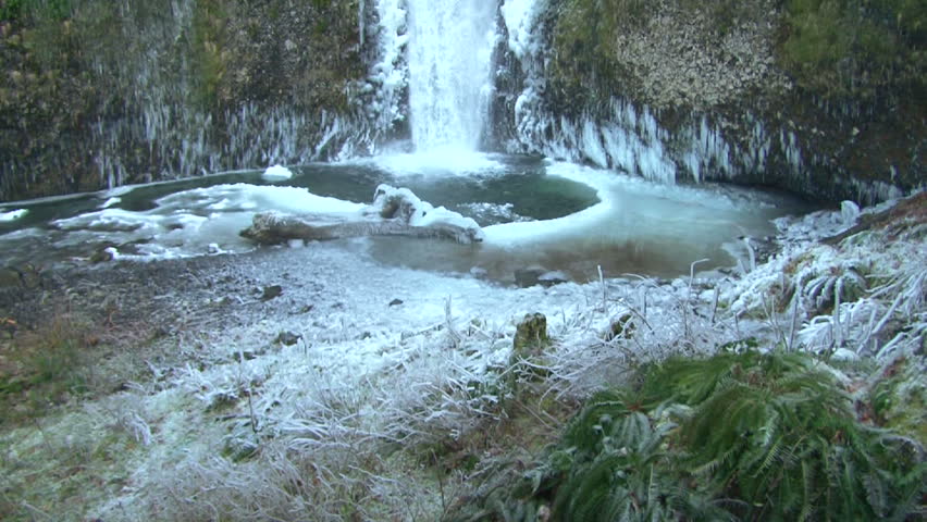 Tilt up on Multnomah Falls in Oregon during winter.