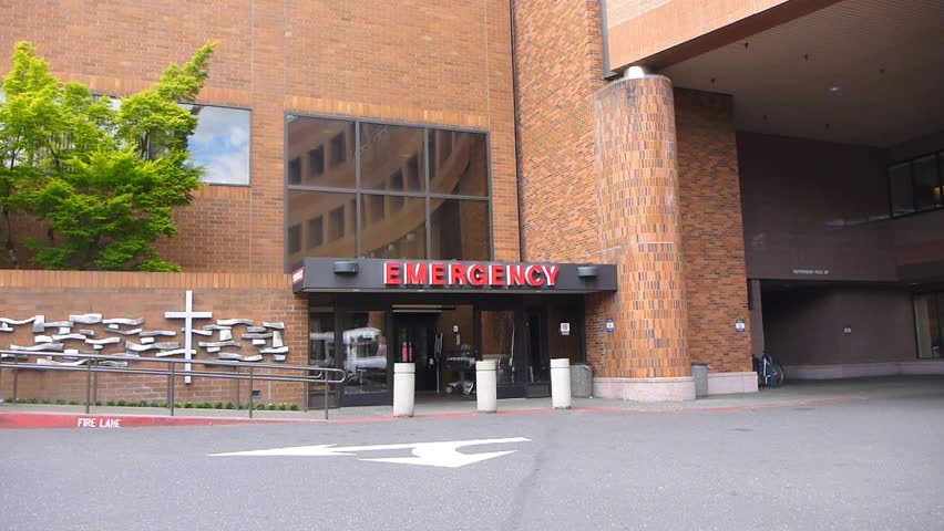 PORTLAND, OREGON - CIRCA 2012 - Hospital entrance at emergency room with nurse