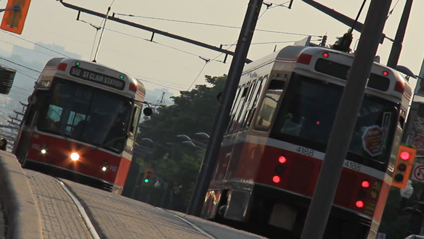 TORONTO - CIRCA JULY 2011: The distinct streetcars in Toronto, Canada passing