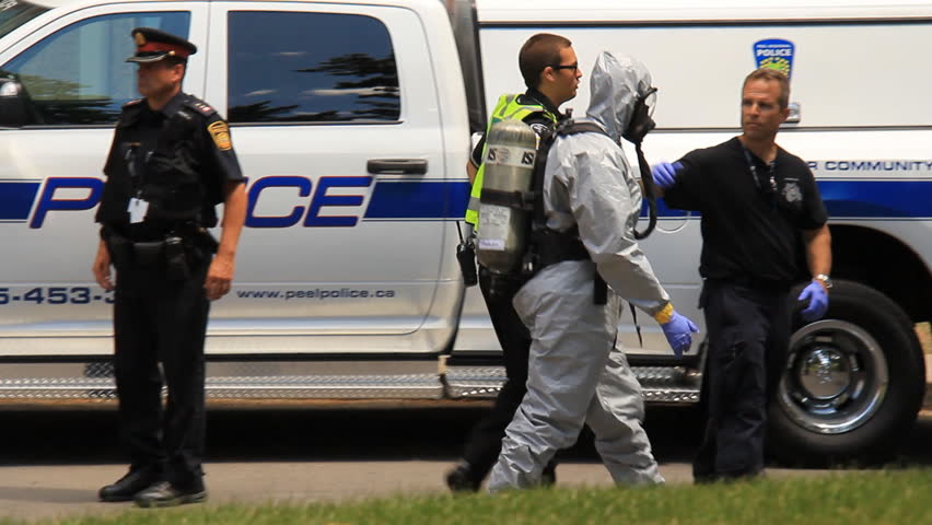 MISSISSAUGA, CANADA - JULY 1 2012: Police in hazardous materials suits working