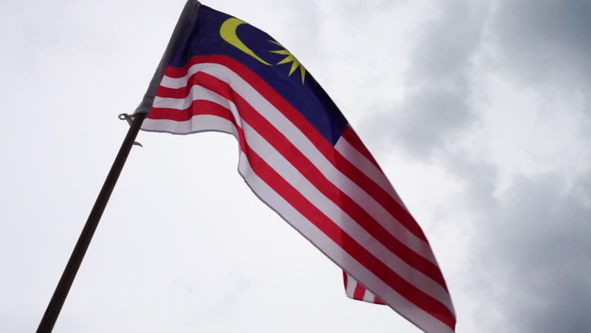 Slow Motion - Malaysia flag waves in the wind. White/Gloomy sky. Merdeka or Independence Day Celebration. 250fps, upscaled.