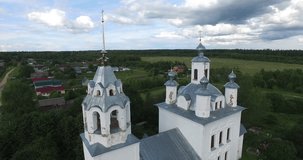 4K aerial video footage view of medieval beautiful lone church in Troickoye village and area around it near Pereslavl-Zalesskiy on Golden Ring route 130 km from Moscow, Russia in summer day
