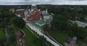 4K aerial video footage view of medieval beautiful Khotkovo Pokrov women monastery (founded 1308) and area around it in summer day near Sergiev Posad on Golden Ring route 90 km from Moscow, Russia