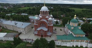 4K aerial video footage view of medieval beautiful Khotkovo Pokrov women monastery (founded 1308) and area around it in summer day near Sergiev Posad on Golden Ring route 90 km from Moscow, Russia