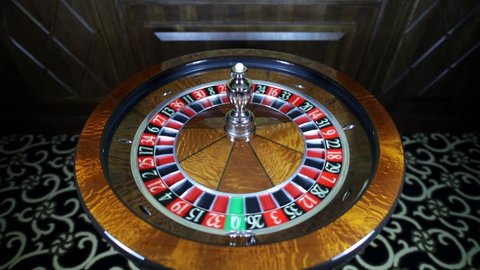 Spinning the ball. American Roulette wheel.