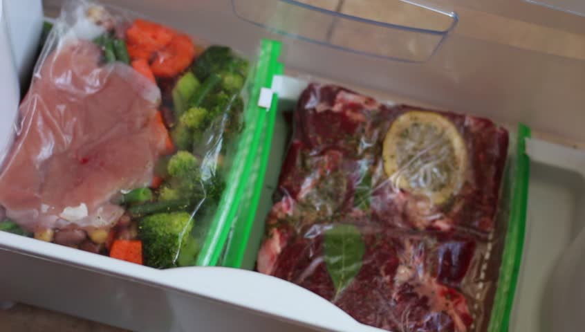 Meal Prep delivery. Food order online. Stocking freezer with homemade meals. Healthy Frozen Dinners Royalty-Free Stock Footage #29798914