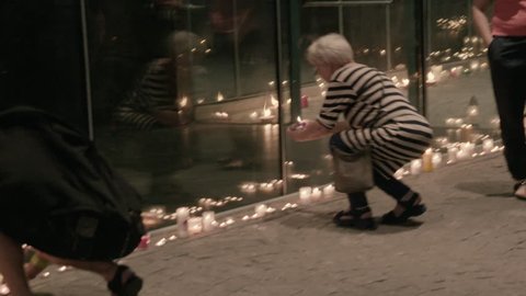 People are lighting the candles at the manifestation in Warsaw Poland about free courts.