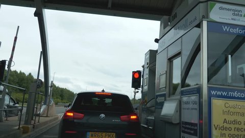 BIRMINGHAM, WEST MIDLANDS, ENGLAND - AUGUST 13TH 2017: M6 toll booth on motorway