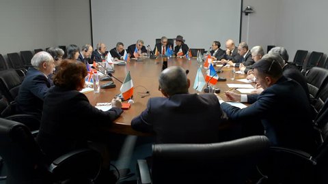 International negotiations for a round table. Statesman or politicians are seriously discussing the problem of ecology