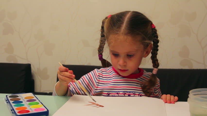 little girl paints