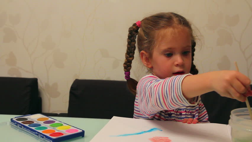little girl paints