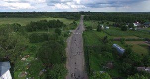4K aerial video footage view of medieval beautiful white stone church in Troickoye village and area around it near Pereslavl-Zalesskiy on Golden Ring route 130 km from Moscow, Russia in summer day
