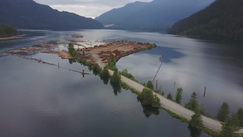 Aerial view of a wood mill factory in Harrison Mills, East of Vancouver, British Columbia, Canada. Taken on a cloudy evening in springtime.