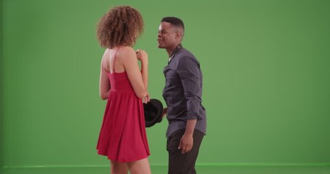 Millennial African American couple dance on green screen. On green screen to be keyed or composited.