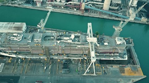 MONFALCONE, ITALY - AUGUST 9, 2017. Aerial view of modern cruise ship MSC Seaview under construction at the Fincantieri shipyard