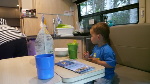 A family camping inside a luxurious rv motorhome