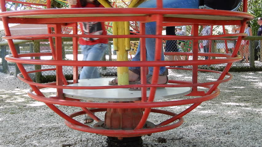 Kids on a red tourniquet at the park