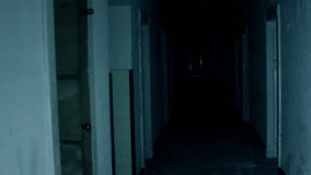 Female ghost in the dark hall - horror concept - Powered by Shutterstock - Get 15% off with code: PIKWIZARD15