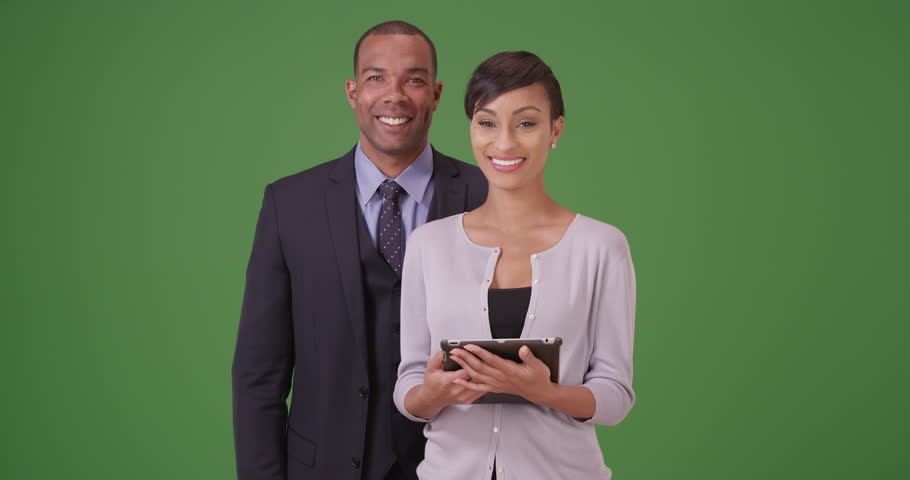 African American man and woman posing for a portrait on green screen. On green screen to be keyed or composited.