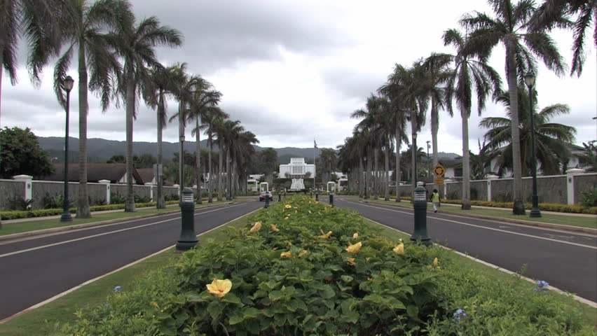 Mormon, LDS temple in Oahu, Hawaii. Large white building in a tropical garden. Church of Jesus Christ of Latter-Day Saints.  Sacred edifice and place of worship. Zoom in.