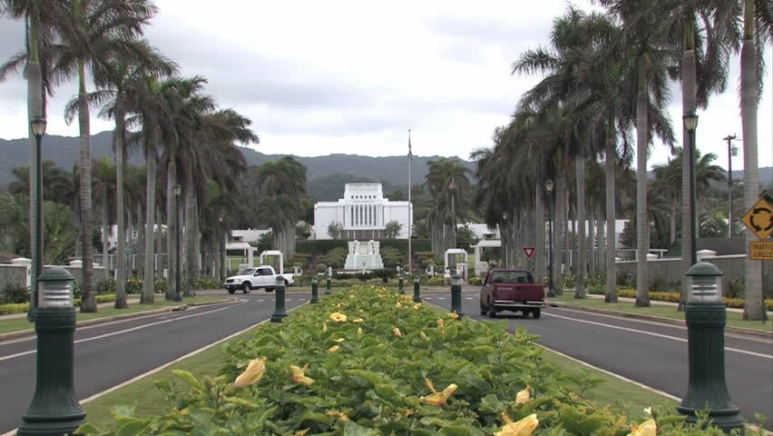 Mormon, LDS temple in Oahu, Hawaii. Large white building in a tropical garden. Church of Jesus Christ of Latter-Day Saints.  Sacred edifice and place of worship.