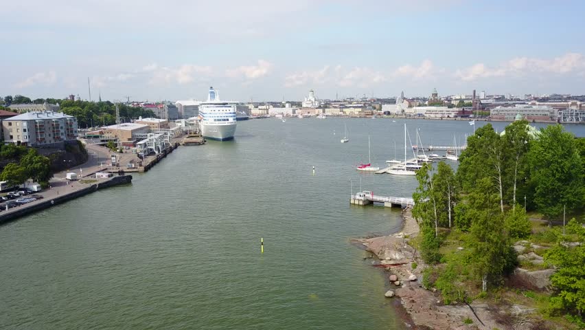4K aerial view drone footage of Helsinki recreation area with sea bay, bungee jumping tower, boats, yachts, coastline and park near Uunisaari and Liuskaluoto in the capital of Finland, northern Europe