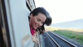 Smiling woman traveling by train