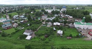 4K aerial video footage view of medieval Suzdal Kremlin town, its churches, cathedrals, fire brigade tower and area around on summer day near Vladimir on Golden Ring route 240 km from Moscow, Russia