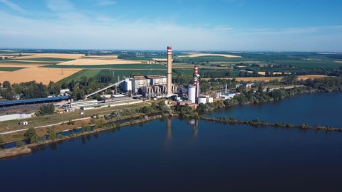 Aerial view of power plant on the lake coast.