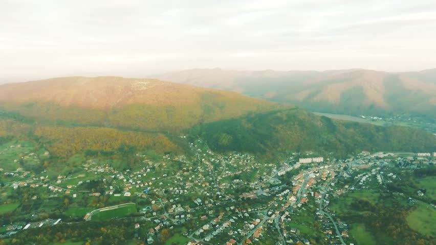 Aerial view of small town with hills, Slovakia. Autumn nature.