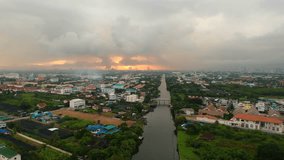 Aerial view from drone looking at sunrise and turn to raining in 4k