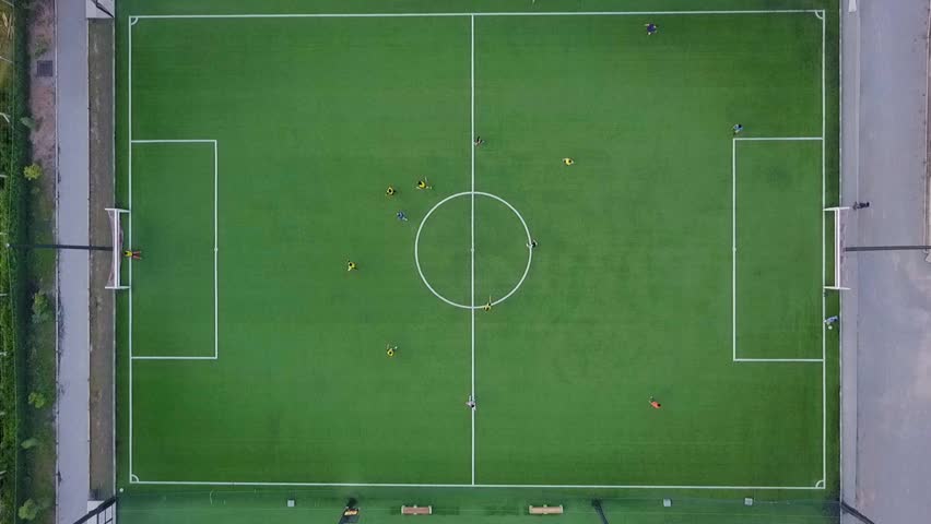  aerial view of football team practicing at day on soccer field in top view Royalty-Free Stock Footage #29881426