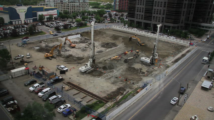 Wide shot of construction breaking ground on a site in downtown Calgary