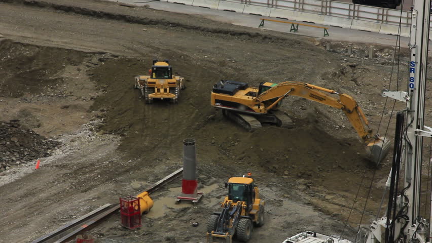 At this job site in downtown Calgary, Alberta workers use a Track-Type Tractor