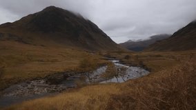 Road to Dalness, Loch Etive, Glencoe, Scotland. Timelapse and video sequences with sound showing the mountains along the river on a cloudy dramatic morning.