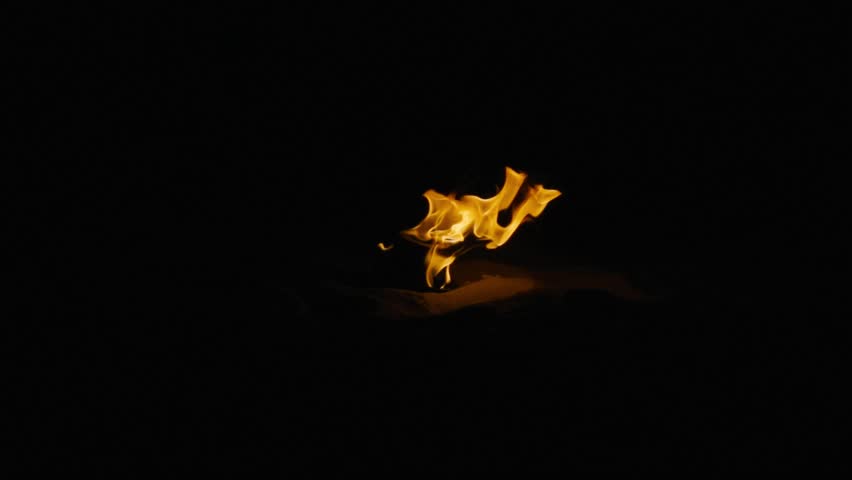 Orange fiery blazes of fire in slow motion 250 FPS, night, black background, sand, Tongues of flames dancing in darkness, mesmerizing spectacle, hypnotic effects, symbolizes eternity, elemental
