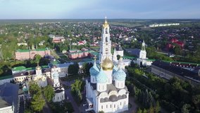 4K aerial view drone video of Sergiev Posad medieval Troice-Sergiev's Lavra complex of churches, cathedrals, walls, roads and area around in small town 70 km east of Moscow, Russia on summer morning
