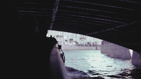 Tourists ride under bridges through the canals of St. Petersburg. slow motion, 1920x1080, full hd