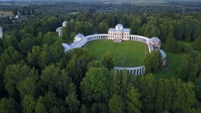 4K aerial video footage view of Znamenskoye-Raek (Paradise) noble estate located between town Tver and Moscow, near Volga river, its large white stone mansion building, in central Russia