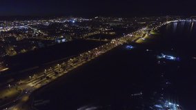 Aerial 180 pan of the nights sky in the south of the Spain part 2 of 3.  The city lights of Malaga, Spain are beautifully highlighted by the peaceful darkness of the sea. 4k 30fps august 11, 2015