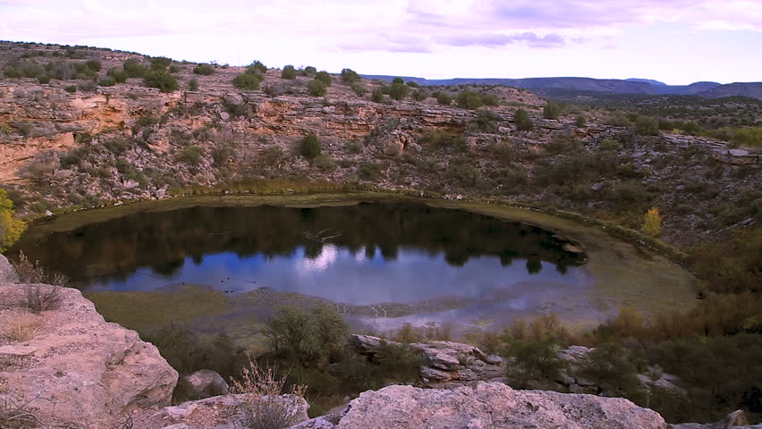 Montezuma Well is a natural limestone sinkhole near the town of Rimrock, Arizona through which some 1,500,000 US gallons of water emerge each day from an underground spring.