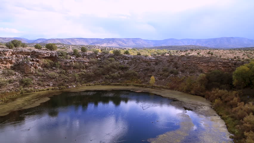 Montezuma Well is a natural limestone sinkhole near the town of Rimrock, Arizona through which some 1,500,000 US gallons of water emerge each day from an underground spring.